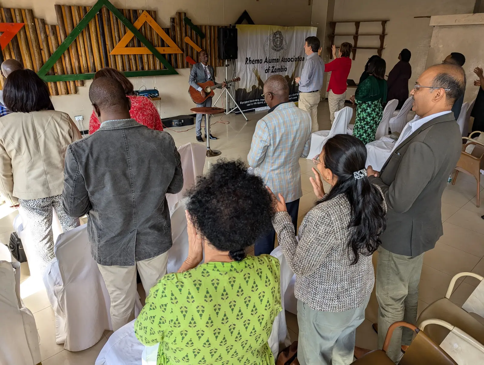 Attendees of the inagural RAAZ Ministers Fellowship praying and singing